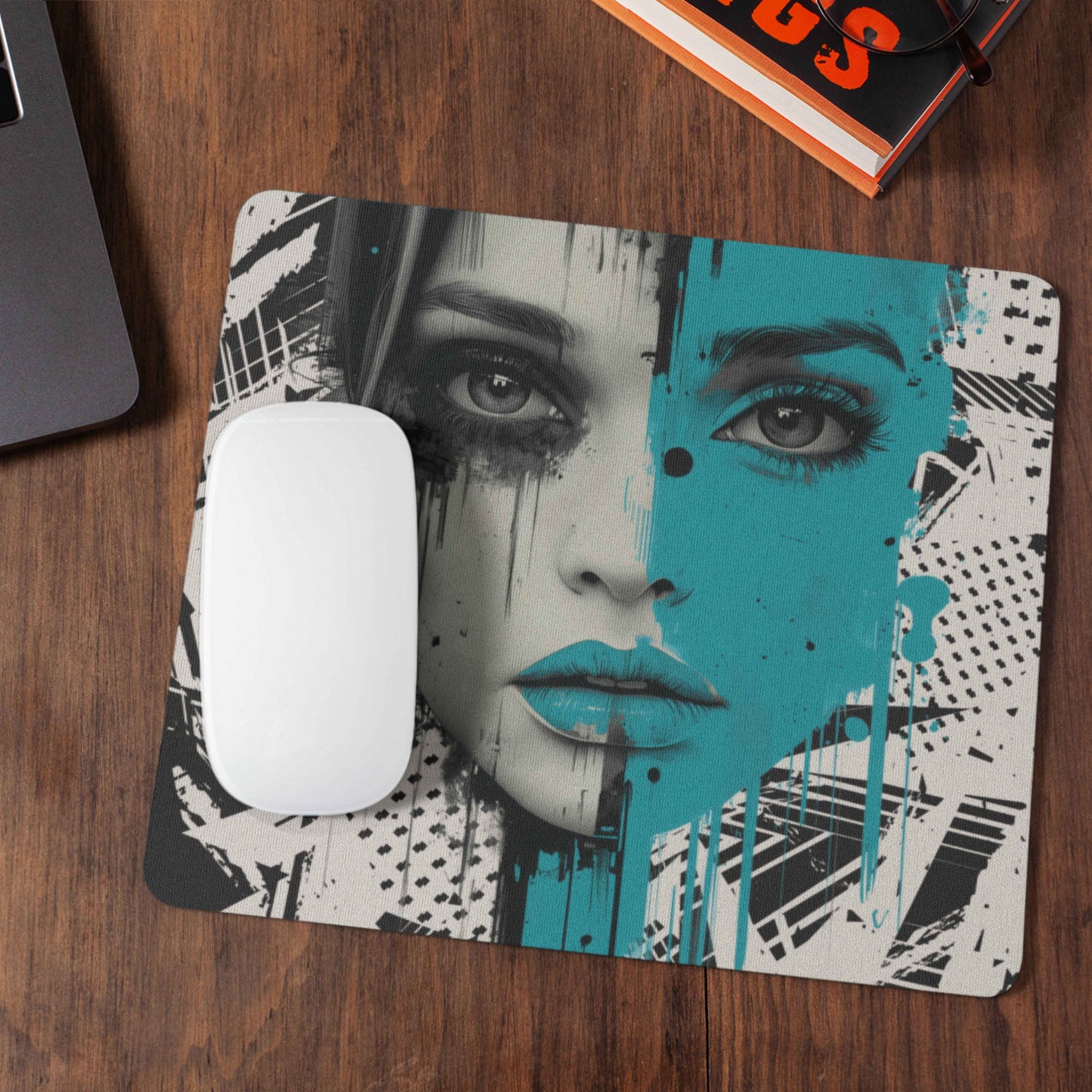 Get a head start on International Women's Day with this urban chic mouse pad. The center of the mouse pad features a woman's face on a black and gray background with half of her face in a contrasting bright teal color.