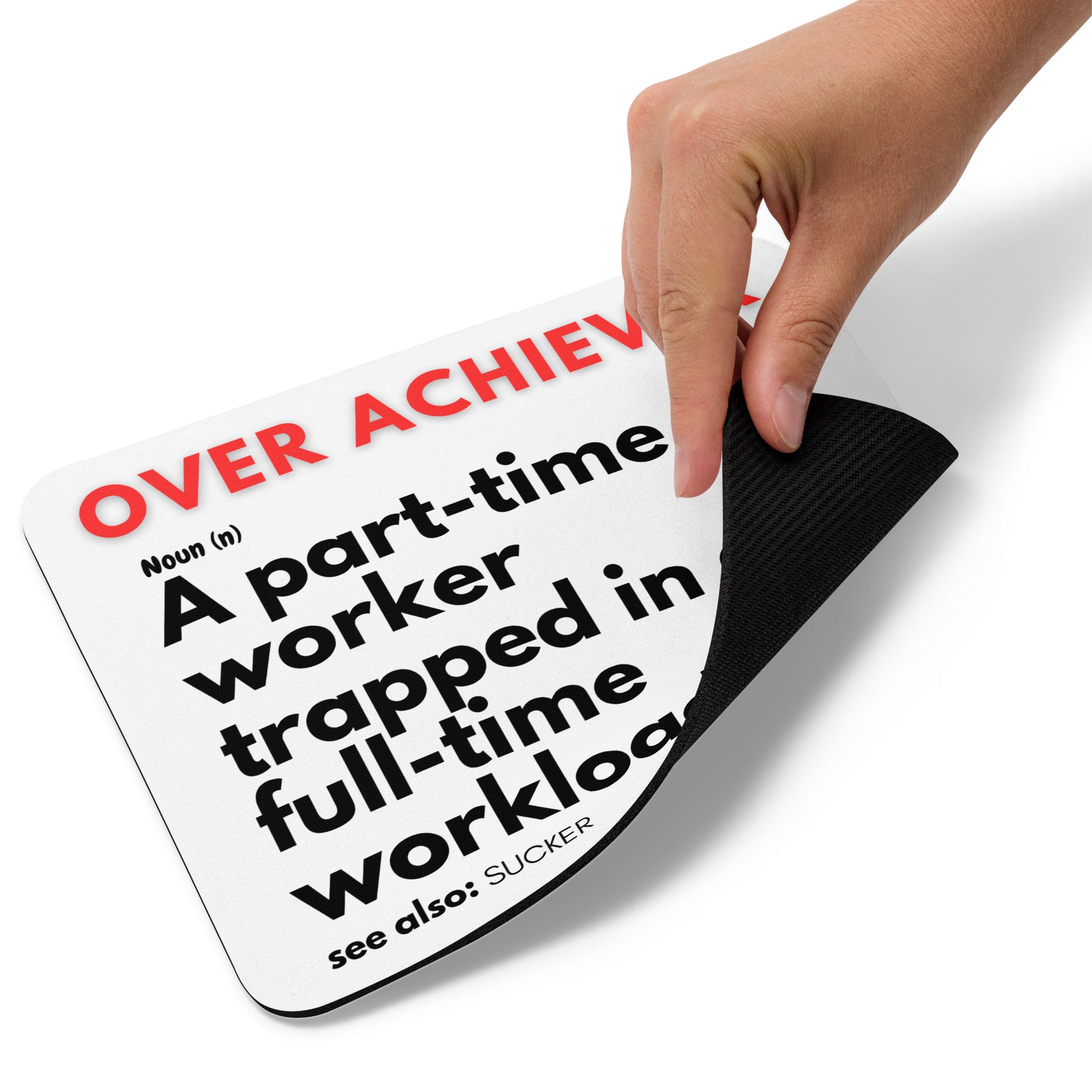 White mouse pad with a soft polyester surface and rubber base featuring a fun definition of an OVER-ACHIEVER - A part-time worker trapped in a full-time workload.