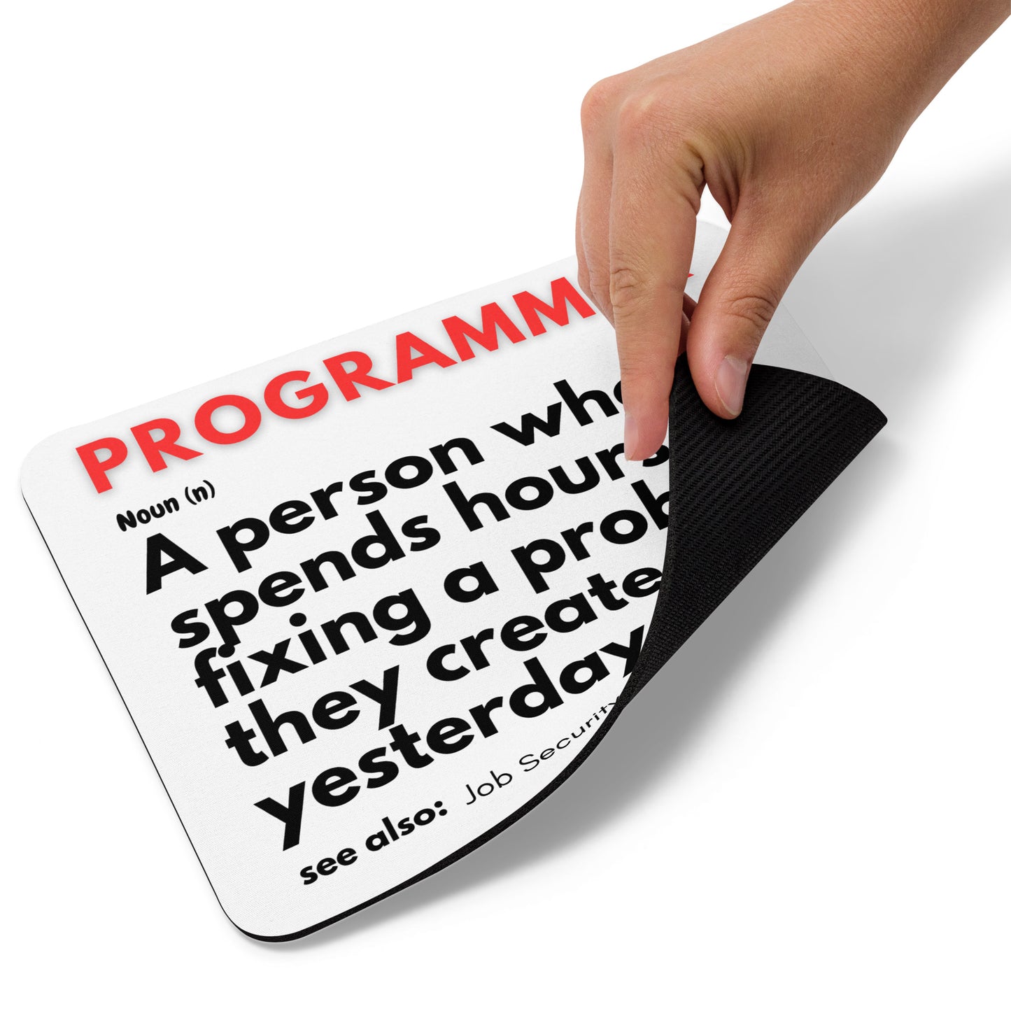 White mouse pad with a soft polyester surface and rubber base featuring a fun definition of a PROGRAMMER - "A person who spends hours fixing a problem they created yesterday."