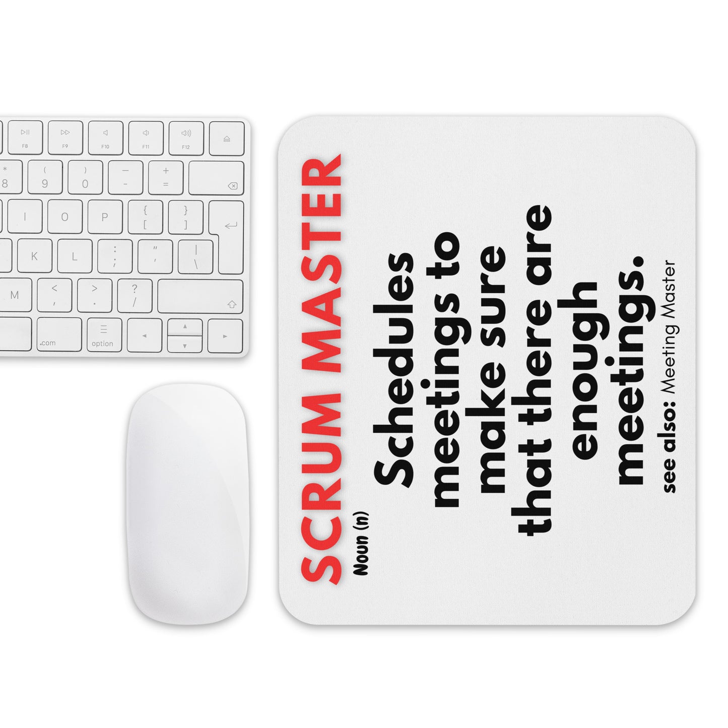 White mouse pad with a soft polyester surface and rubber base featuring a fun definition of what a Scrum Master does - "Schedules meetings to make sure that there are enough meetings."