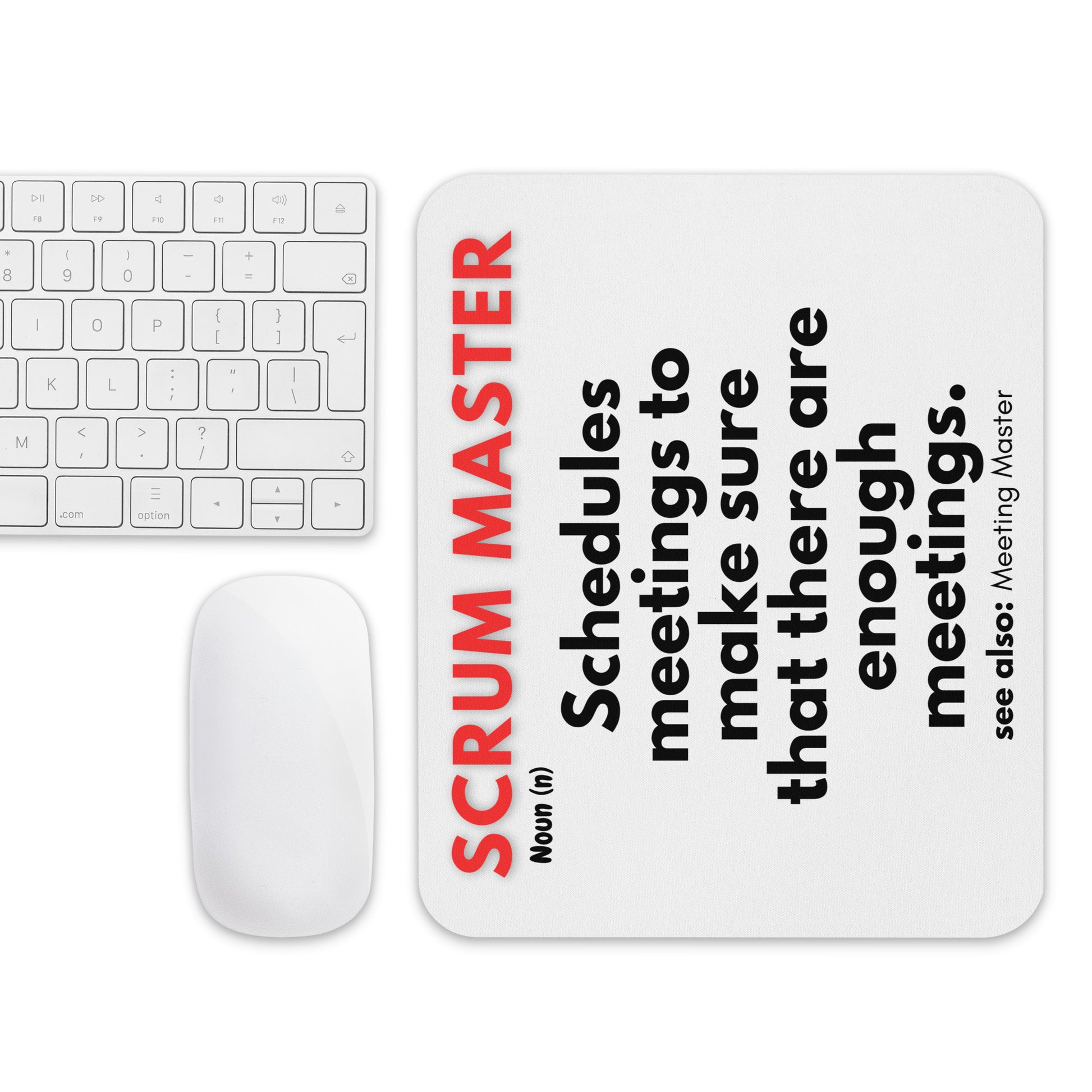 White mouse pad with a soft polyester surface and rubber base featuring a fun definition of what a Scrum Master does - "Schedules meetings to make sure that there are enough meetings."